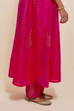 Fuchsia silk long kaftan with hand-embroidered sequins at the neck and diamond motifs along the sides, paired with Fuchsia Silk pants with hand embroidered leaf motifs with delicate sequins work at hem.