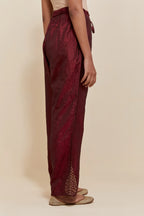 Maroon Silk pants with hand embroidered leaf motifs with delicate sequins work at hem.