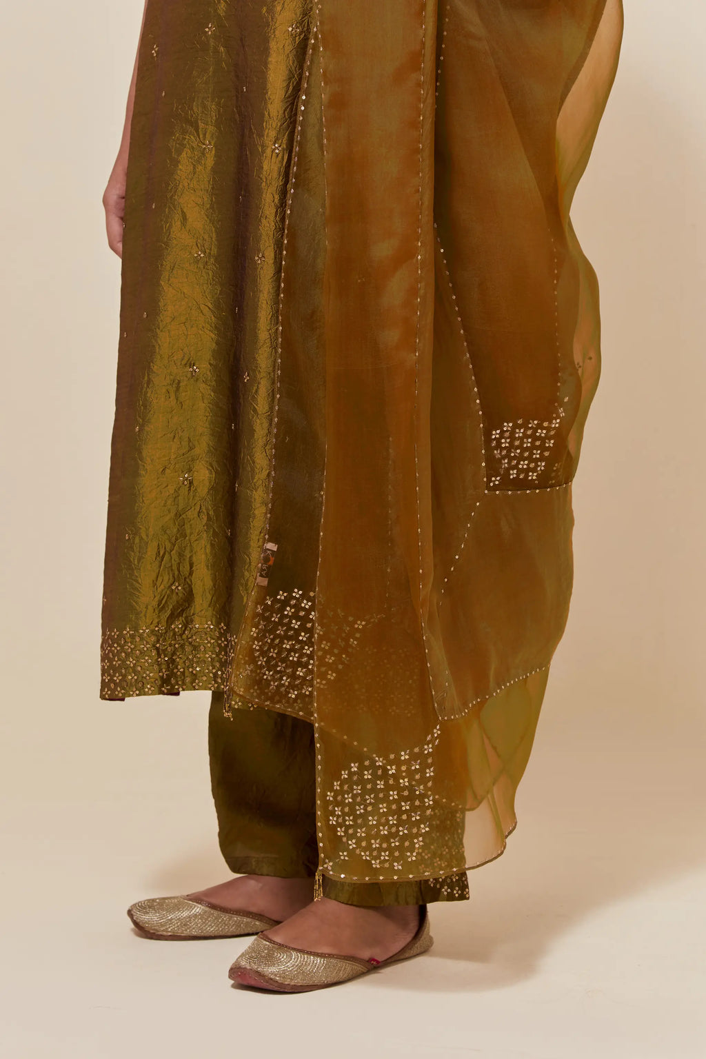 Olive silk dupatta with silk organza at the sides, highlighted with hand-embroidered gold sequins work.