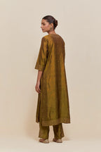 Olive silk straight kurta set with hand-embroidered sequins at the neck, hem and sleeves, highlighted with scattered gold sequins embellishments all-over.