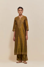 Olive silk straight kurta set with hand-embroidered sequins at the neck, hem and sleeves, highlighted with scattered gold sequins embellishments all-over.