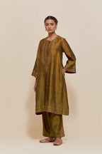 Olive silk A-line short kurta set with hand-embroidered sequins at the neck, borders running along the hem and sleeve edges, and scattered gold sequin embellishments all-over.