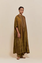 Olive silk long kaftan with hand-embroidered sequins at the neck and diamond motifs along the sides, paired with olive Silk pants with hand embroidered leaf motifs with delicate sequins work at hem.