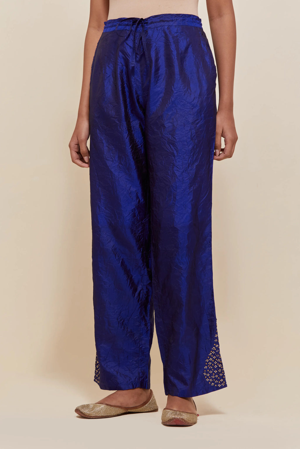 Blue Silk pants with hand embroidered leaf motifs with delicate sequins work at hem.
