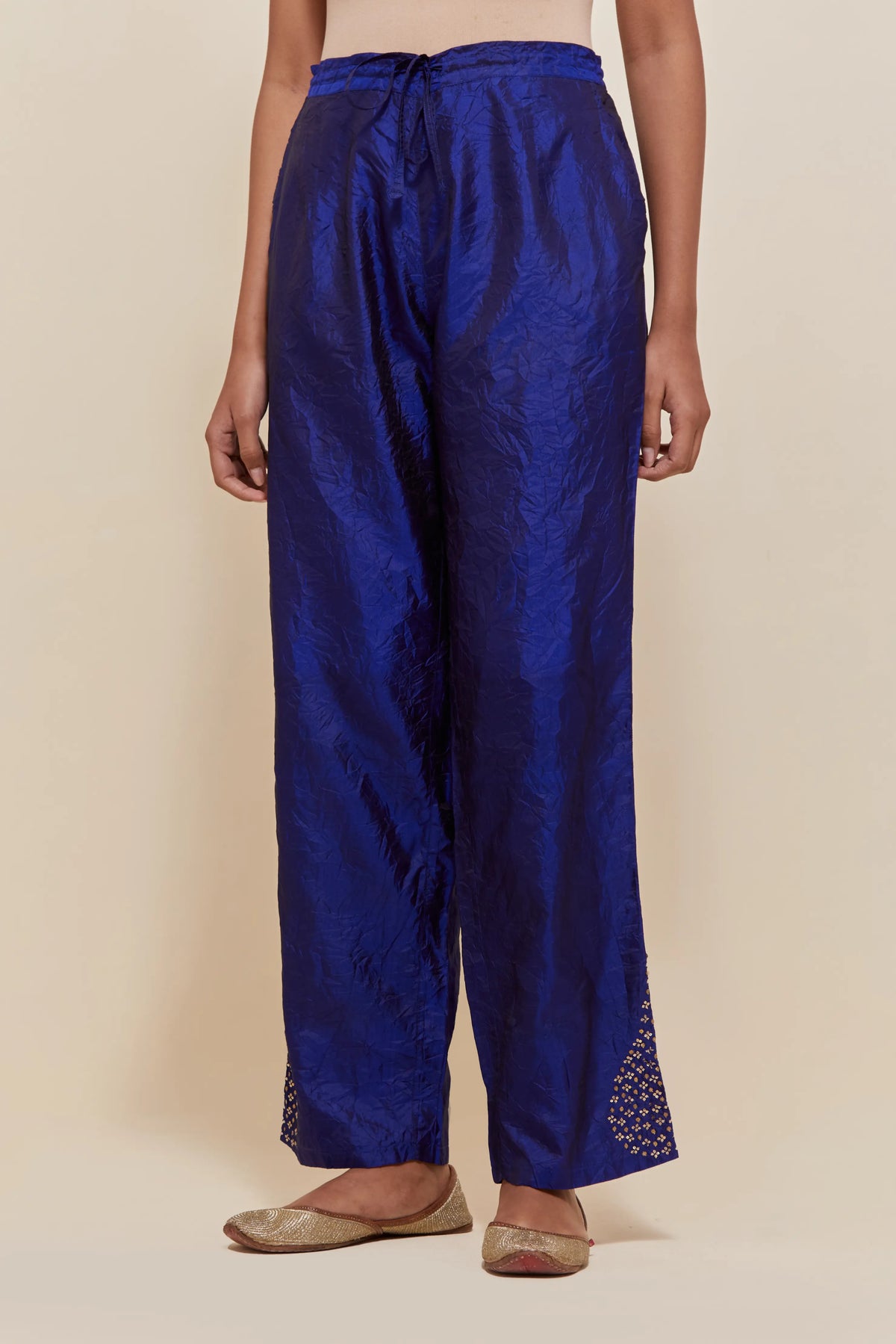 Blue Silk pants with hand embroidered leaf motifs with delicate sequins work at hem.