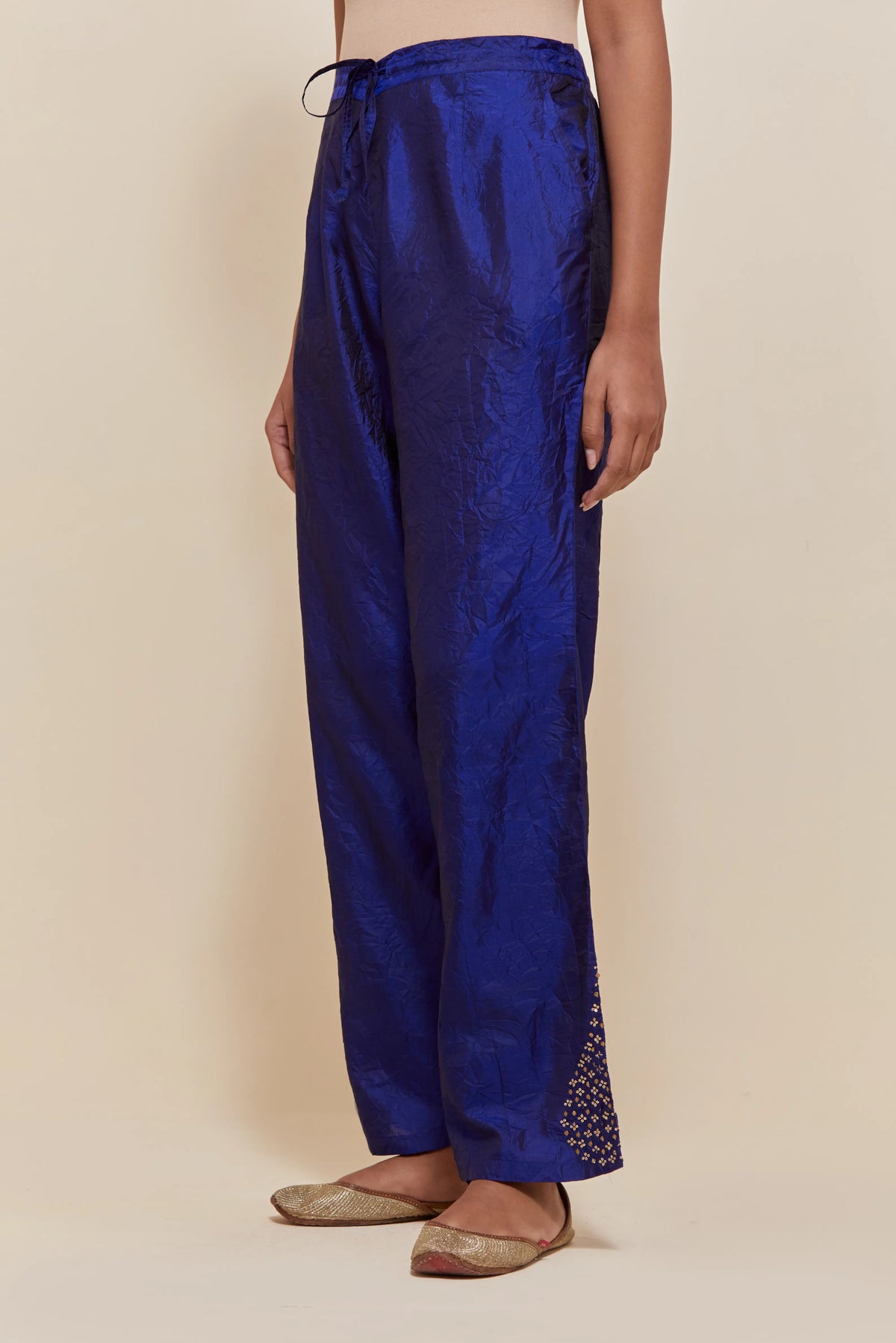 Blue Silk pants with hand embroidered leaf motifs with delicate sequins work at hem.