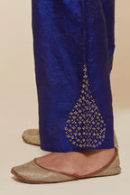 Blue Silk pants with hand embroidered leaf motifs with delicate sequins work at hem.