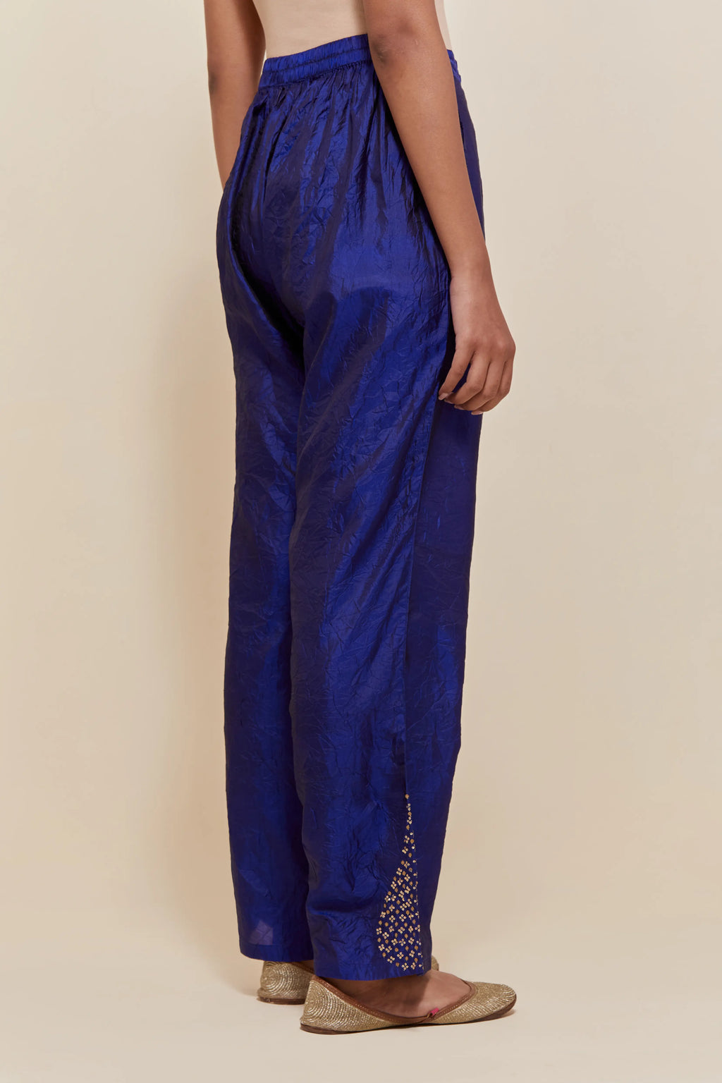 Blue Silk pants with hand embroidered leaf motifs with delicate sequins work at hem.