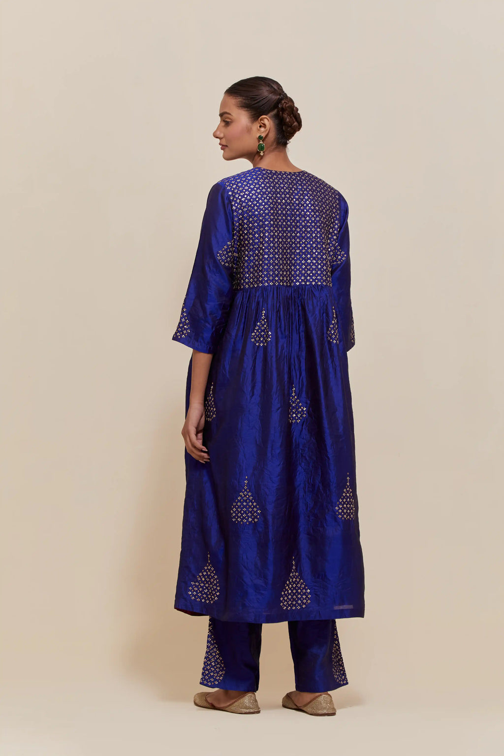 Blue silk kurta set with hand embroidered sequins at yoke and leaf motif all-over the kurta.