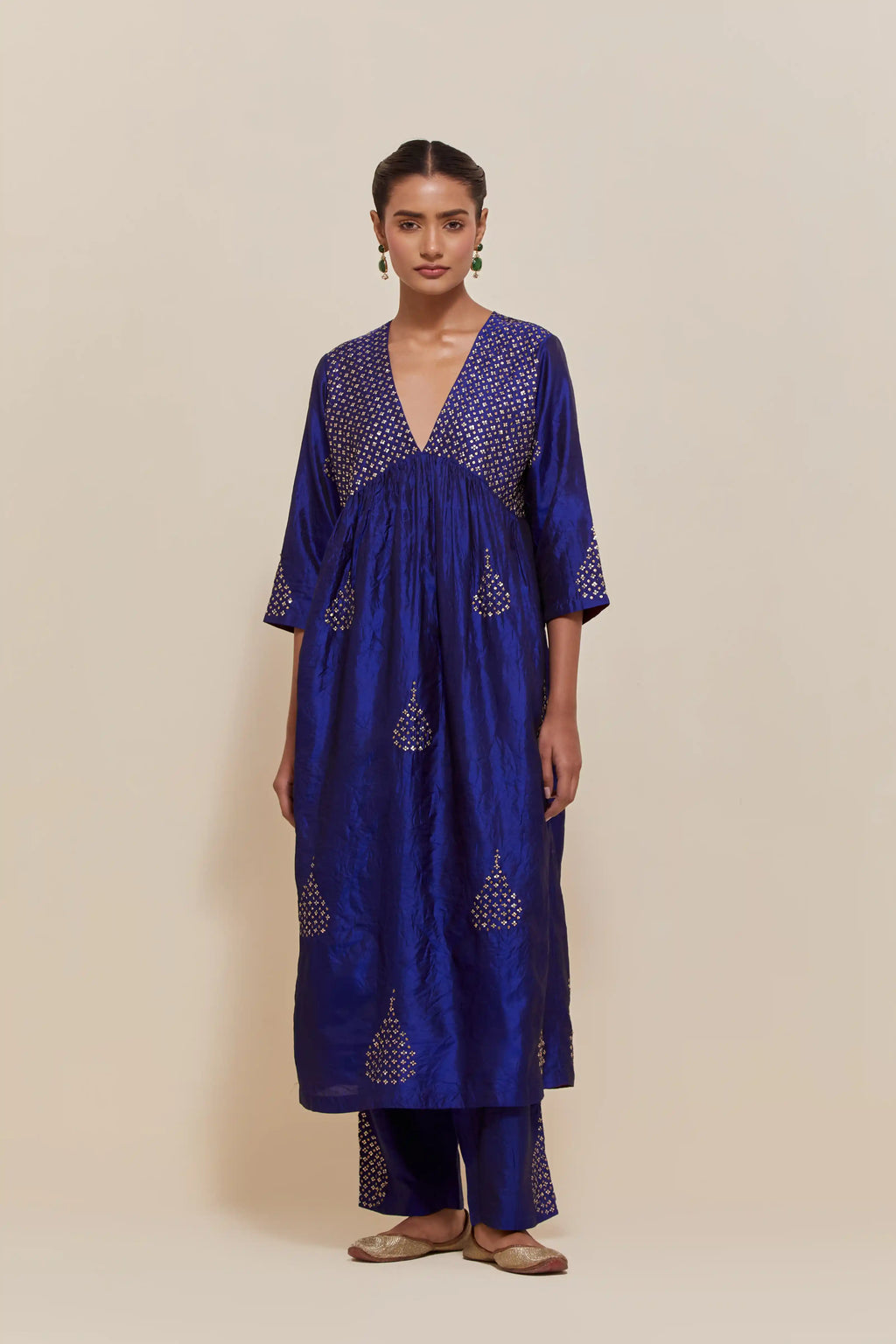 Blue silk kurta set with hand embroidered sequins at yoke and leaf motif all-over the kurta.