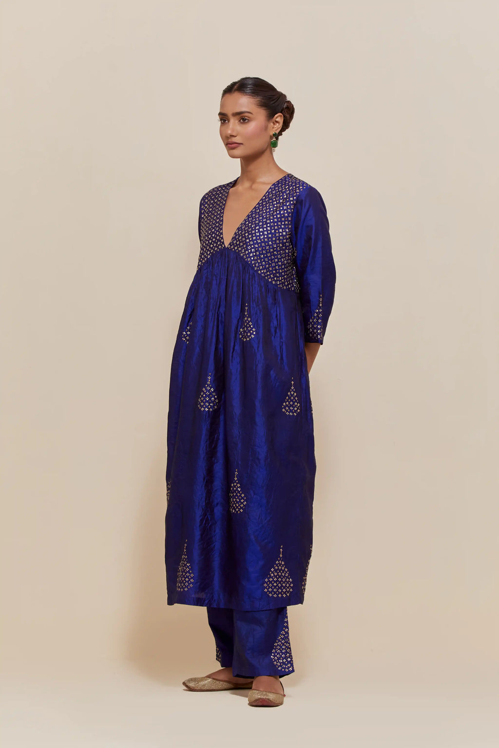 Blue silk kurta set with hand embroidered sequins at yoke and leaf motif all-over the kurta.
