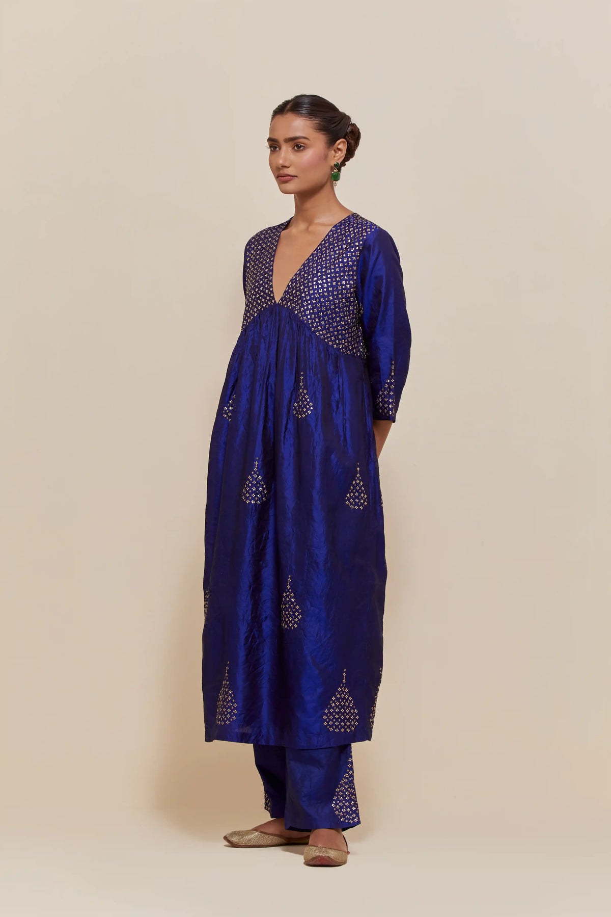 Blue silk kurta set with hand embroidered sequins at yoke and leaf motif all-over the kurta.