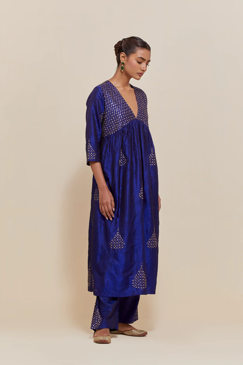 Blue silk kurta set with hand embroidered sequins at yoke and leaf motif all-over the kurta.