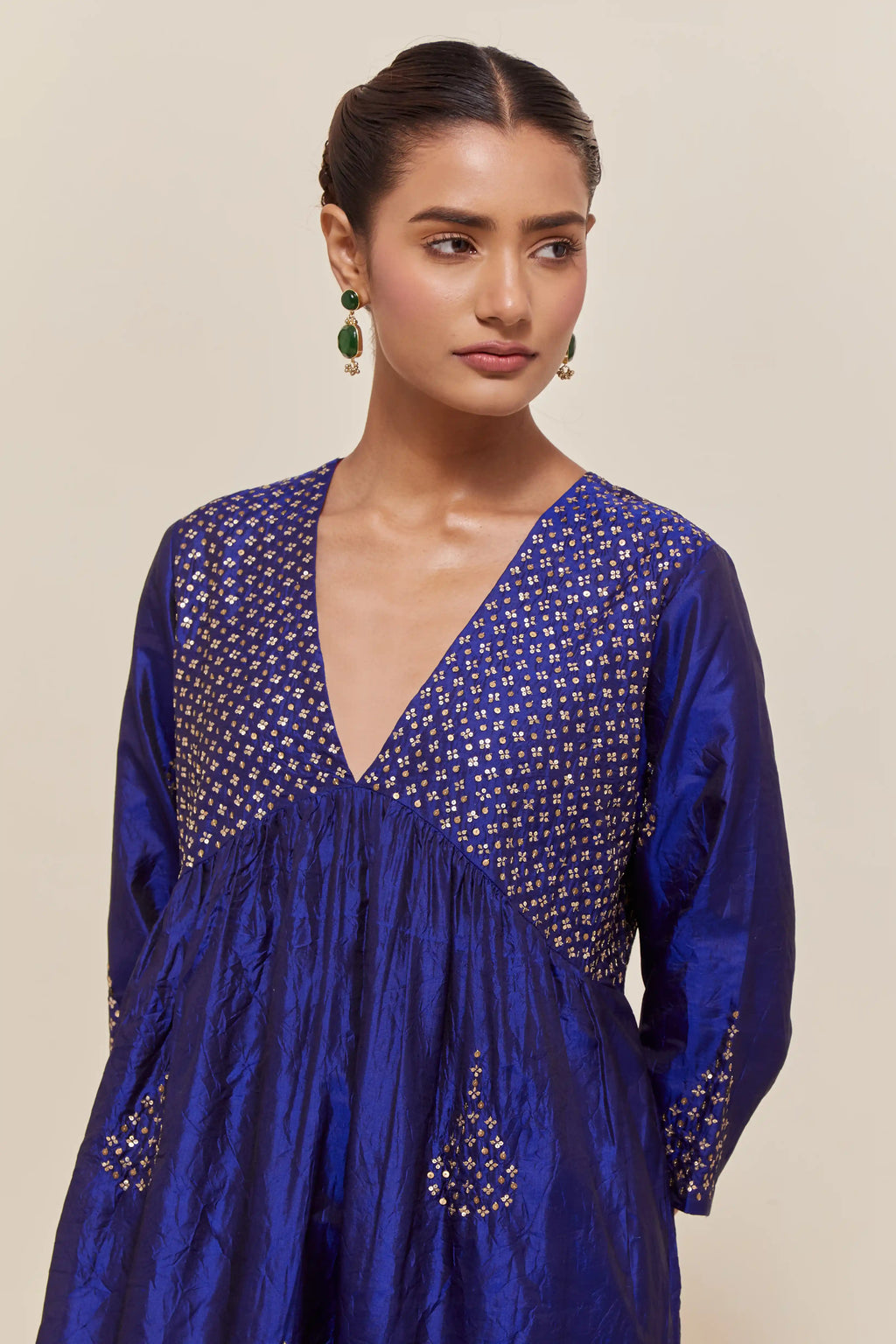 Blue silk kurta set with hand embroidered sequins at yoke and leaf motif all-over the kurta.