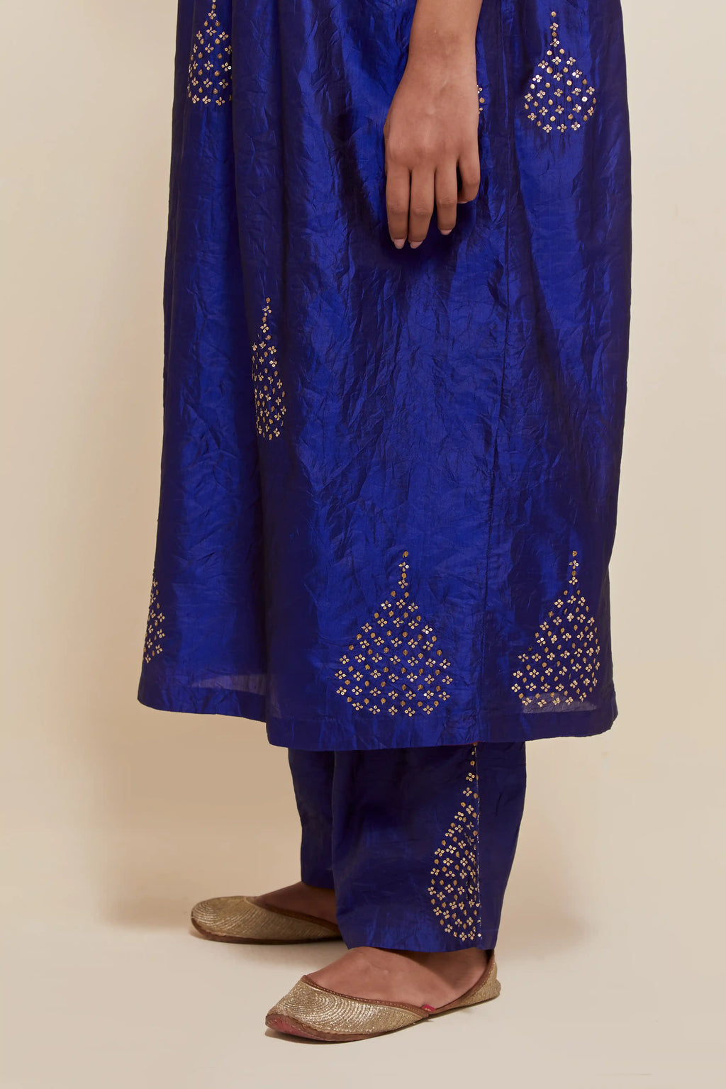 Blue silk kurta set with hand embroidered sequins at yoke and leaf motif all-over the kurta.