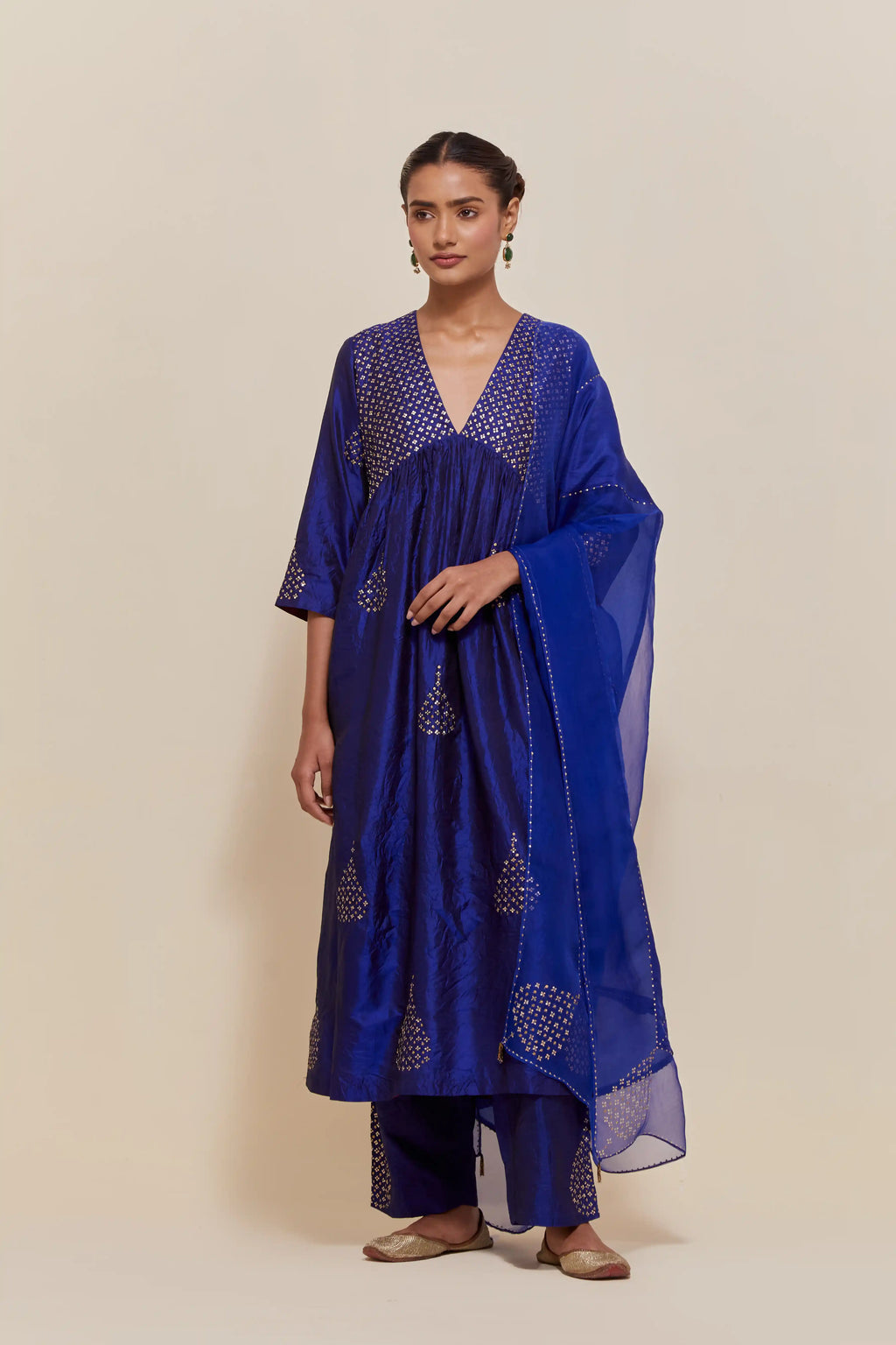 Blue silk kurta set with hand embroidered sequins at yoke and leaf motif all-over the kurta.