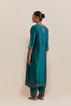 Teal green Silk Chanderi straight kurta set featuring all-over hand-embroidered gold sequins.