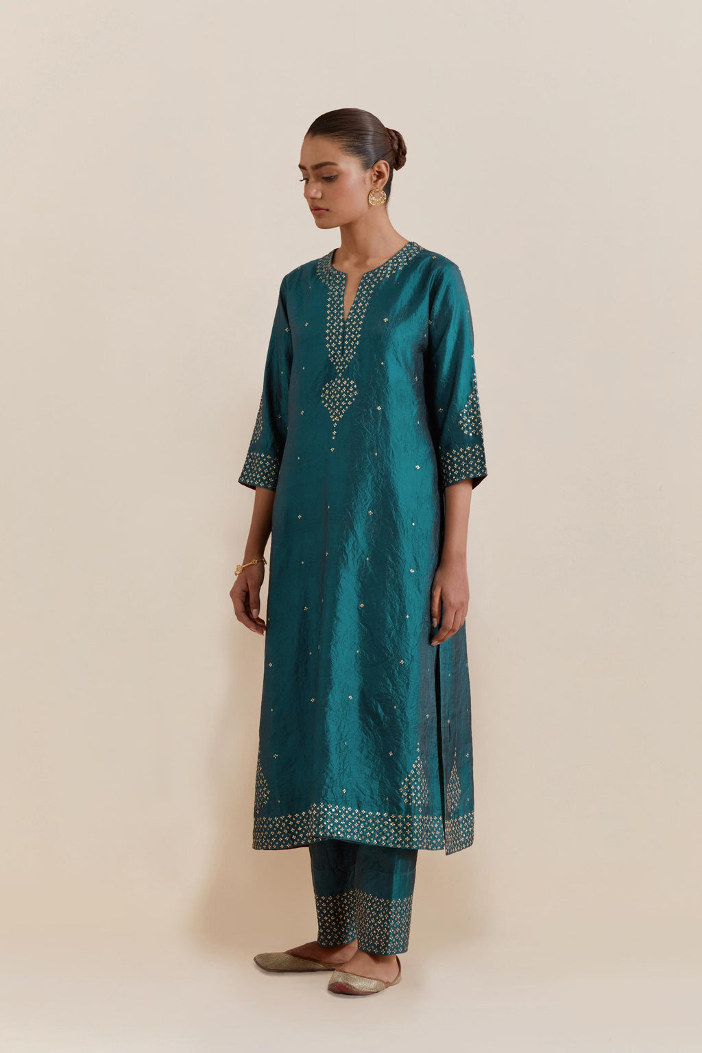 Teal green Silk Chanderi straight kurta set featuring all-over hand-embroidered gold sequins.