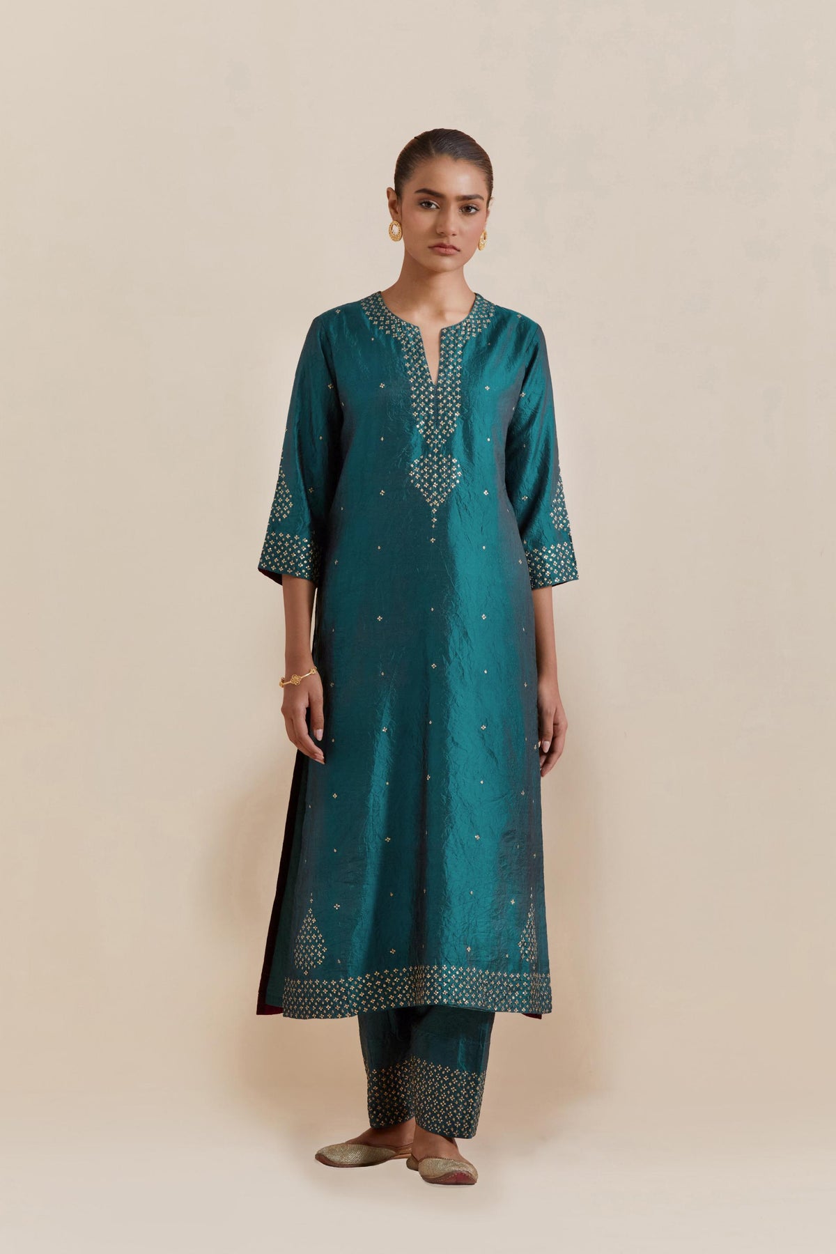 Teal green Silk Chanderi straight kurta set featuring all-over hand-embroidered gold sequins.