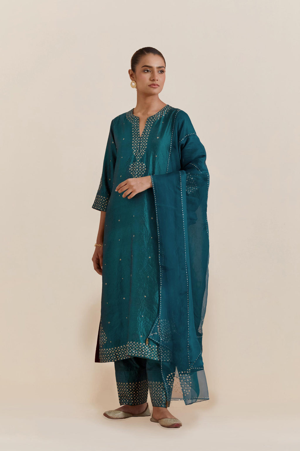 Teal green Silk Chanderi straight kurta set featuring all-over hand-embroidered gold sequins.