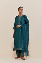 Teal green Silk Chanderi straight kurta set featuring all-over hand-embroidered gold sequins.