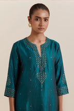 Teal green Silk Chanderi straight kurta set featuring all-over hand-embroidered gold sequins.