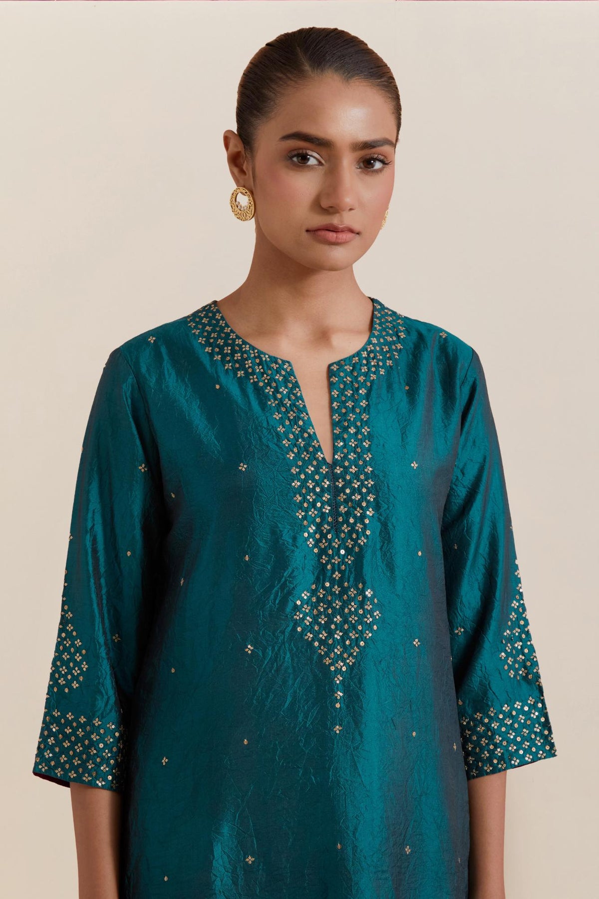 Teal green Silk Chanderi straight kurta set featuring all-over hand-embroidered gold sequins.