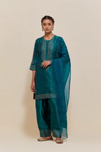 Teal green silk dupatta with silk organza at the sides, highlighted with hand-embroidered gold sequins work.