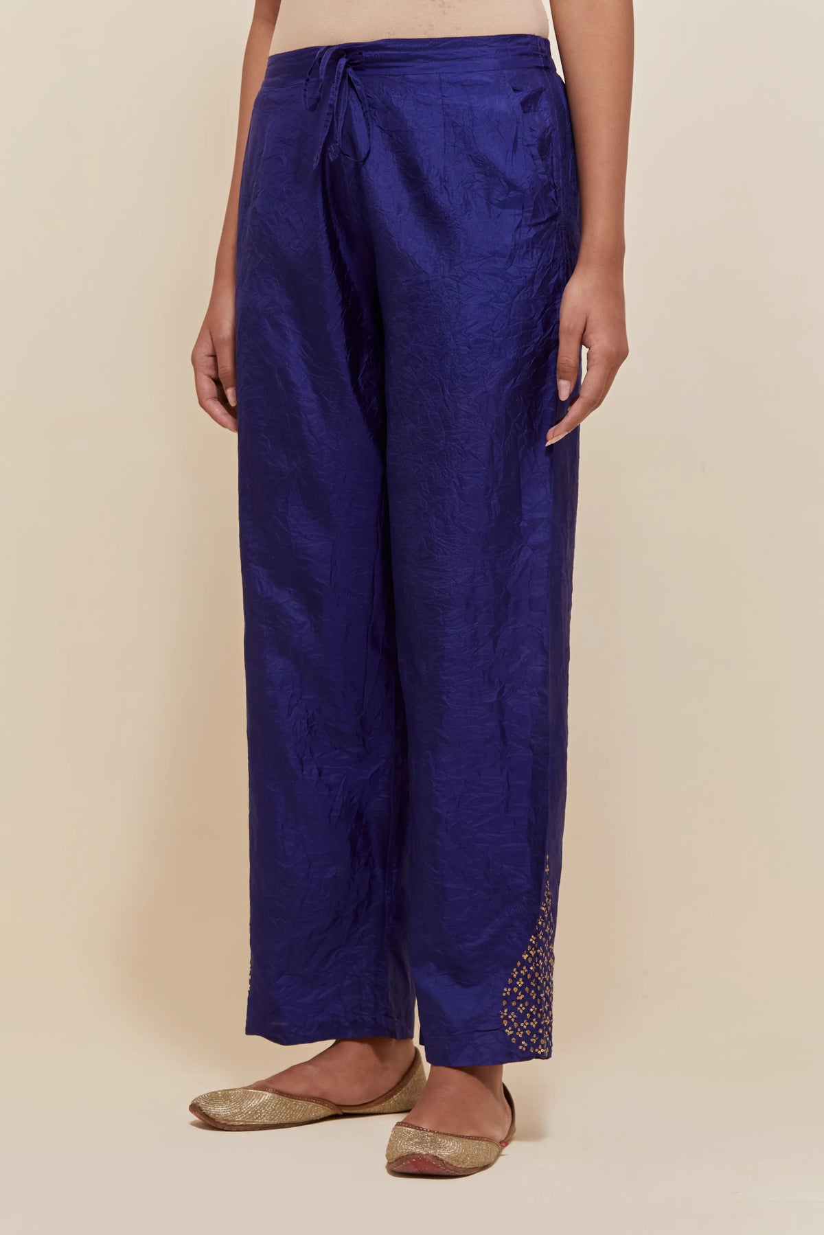 Dark Blue Silk pants with hand embroidered leaf motifs with delicate sequins work at hem.