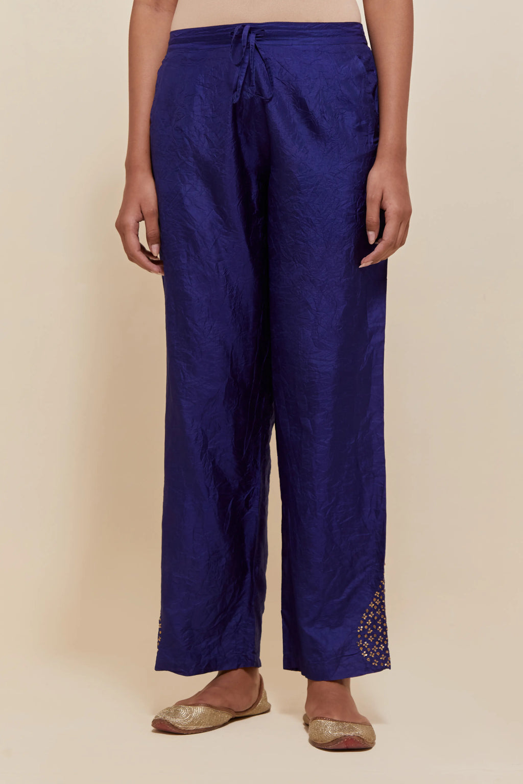 Dark Blue Silk pants with hand embroidered leaf motifs with delicate sequins work at hem.