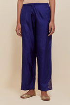 Dark Blue Silk pants with hand embroidered leaf motifs with delicate sequins work at hem.