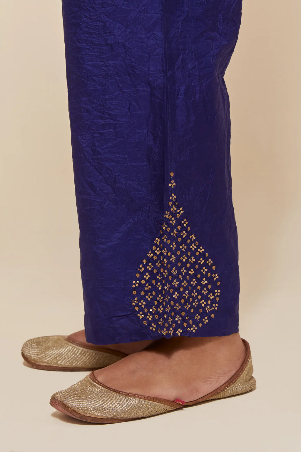 Dark Blue Silk pants with hand embroidered leaf motifs with delicate sequins work at hem.