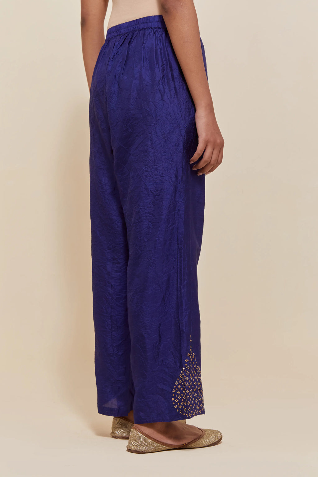 Dark Blue Silk pants with hand embroidered leaf motifs with delicate sequins work at hem.
