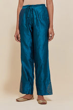 Teal Silk pants with hand embroidered leaf motifs with delicate sequins work at hem.