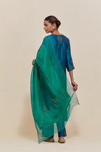 Green silk dupatta with silk organza at the sides, highlighted with hand-embroidered gold sequins work.