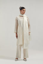 Off white Silk Chanderi short kurta set with hand-embroidered paisley motifs with delicate mirror and sequins work all-over the kurta.