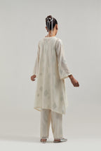 Off white Silk Chanderi A-line short kurta set with hand embroidered diamond motifs with delicate mirror and sequins work all-over the kurta.