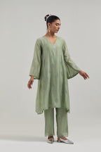 Green Silk Chanderi A-line short kurta set with hand embroidered diamond motifs with delicate mirror and sequins work all-over the kurta.