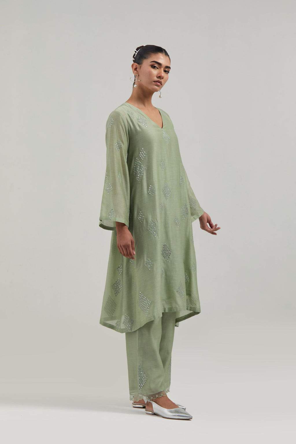 Green Silk Chanderi A-line short kurta set with hand embroidered diamond motifs with delicate mirror and sequins work all-over the kurta.