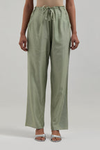 Green silk Chanderi pants with hand-embroidered paisley motifs with delicate mirror and sequins work at the hem.