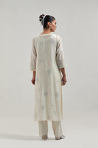 Off white Silk Chanderi straight kurta set with hand embroidered diamond motifs with delicate mirror and sequins work all-over the kurta.