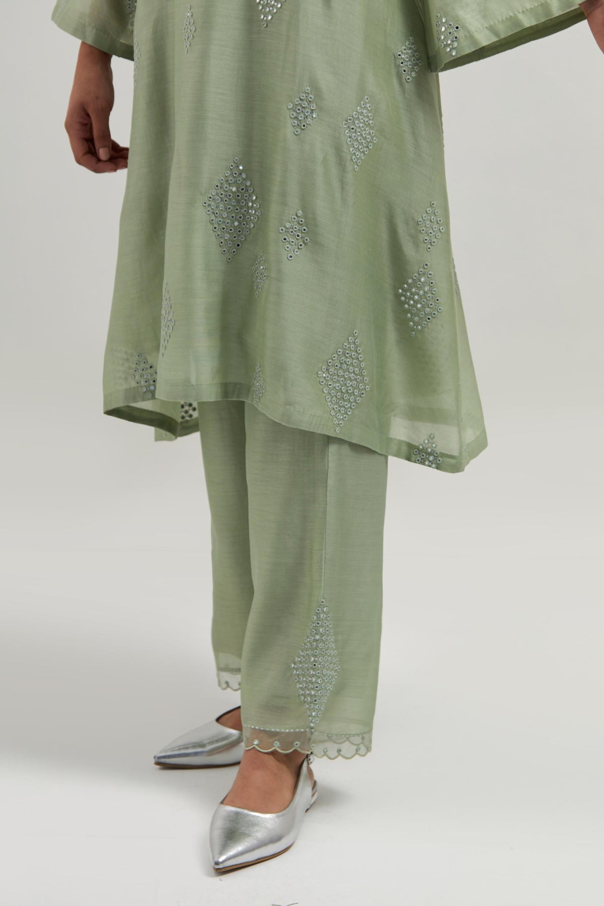 Green Silk Chanderi A-line short kurta set with hand embroidered diamond motifs with delicate mirror and sequins work all-over the kurta.