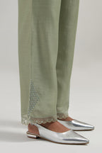Green silk Chanderi straight pants with narrow organza scalloped hem and hand-embroidered diamond motifs with delicate mirror & sequins work at the sides.