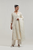 Off white Silk Chanderi straight kurta set with hand embroidered diamond motifs with delicate mirror and sequins work all-over the kurta.