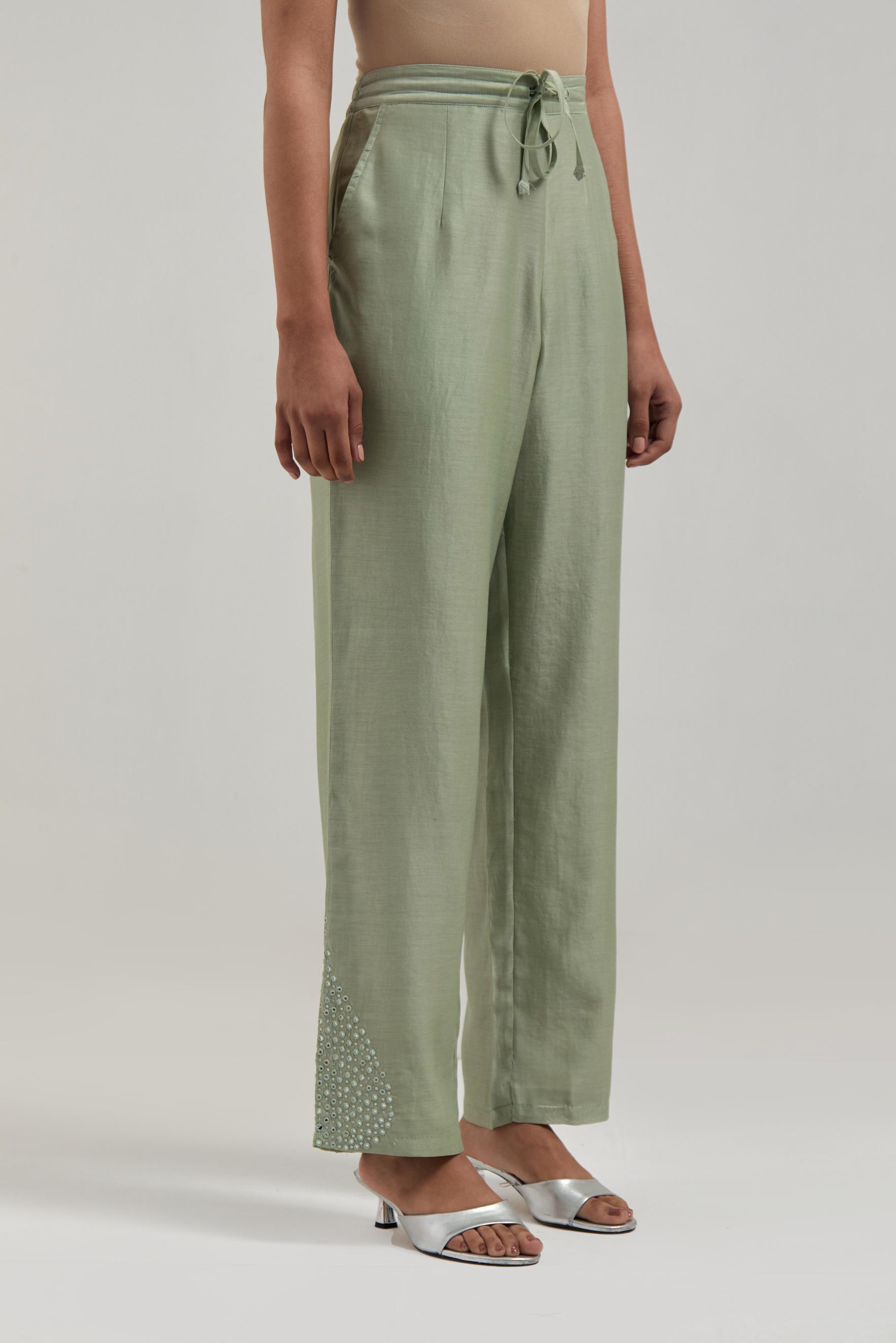 Green Silk Chanderi pants with hand embroidered leaf motifs with delicate mirror & sequins work at hem.