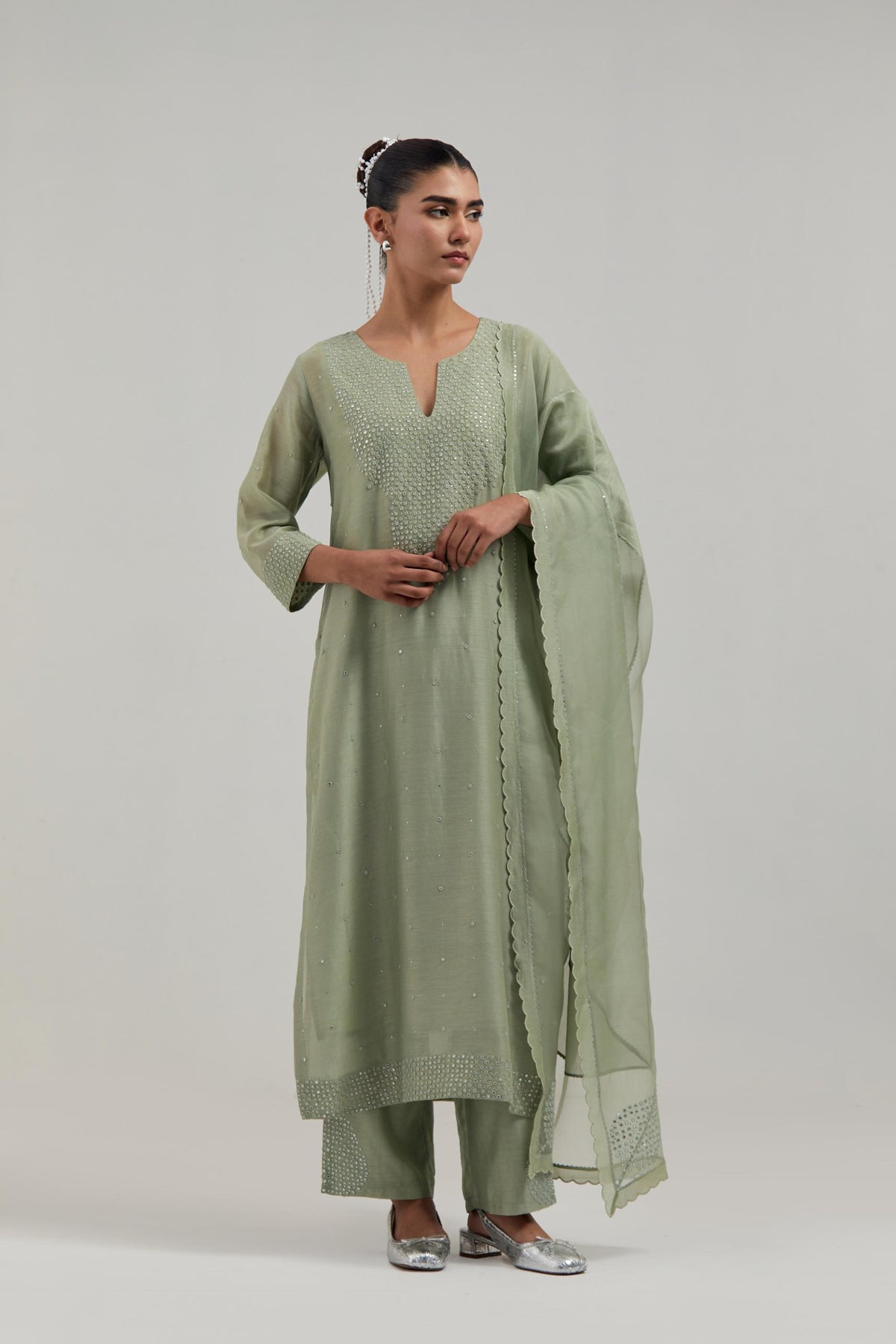 Green silk Chanderi dupatta with silk organza at the sides, finished with delicate scalloped edges, highlighted by hand-embroidered mirror & sequins work.