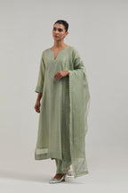 Green silk Chanderi dupatta with silk organza at the sides, finished with delicate scalloped edges, highlighted by hand-embroidered mirror & sequins work.