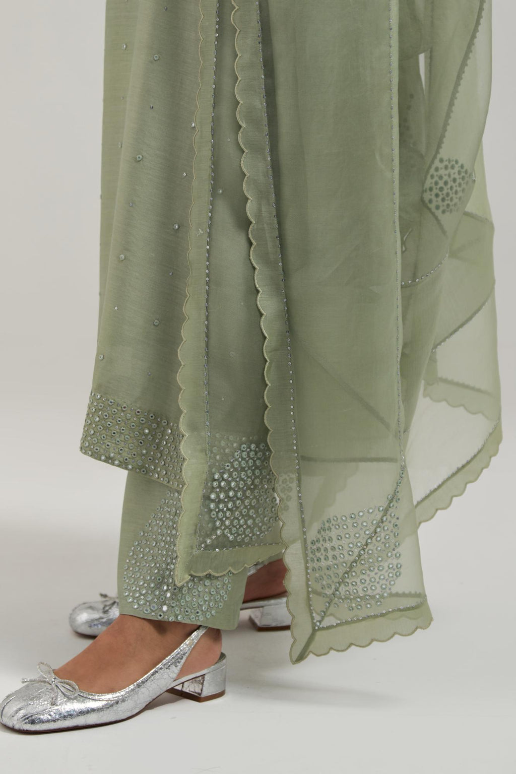 Green silk Chanderi dupatta with silk organza at the sides, finished with delicate scalloped edges, highlighted by hand-embroidered mirror & sequins work.