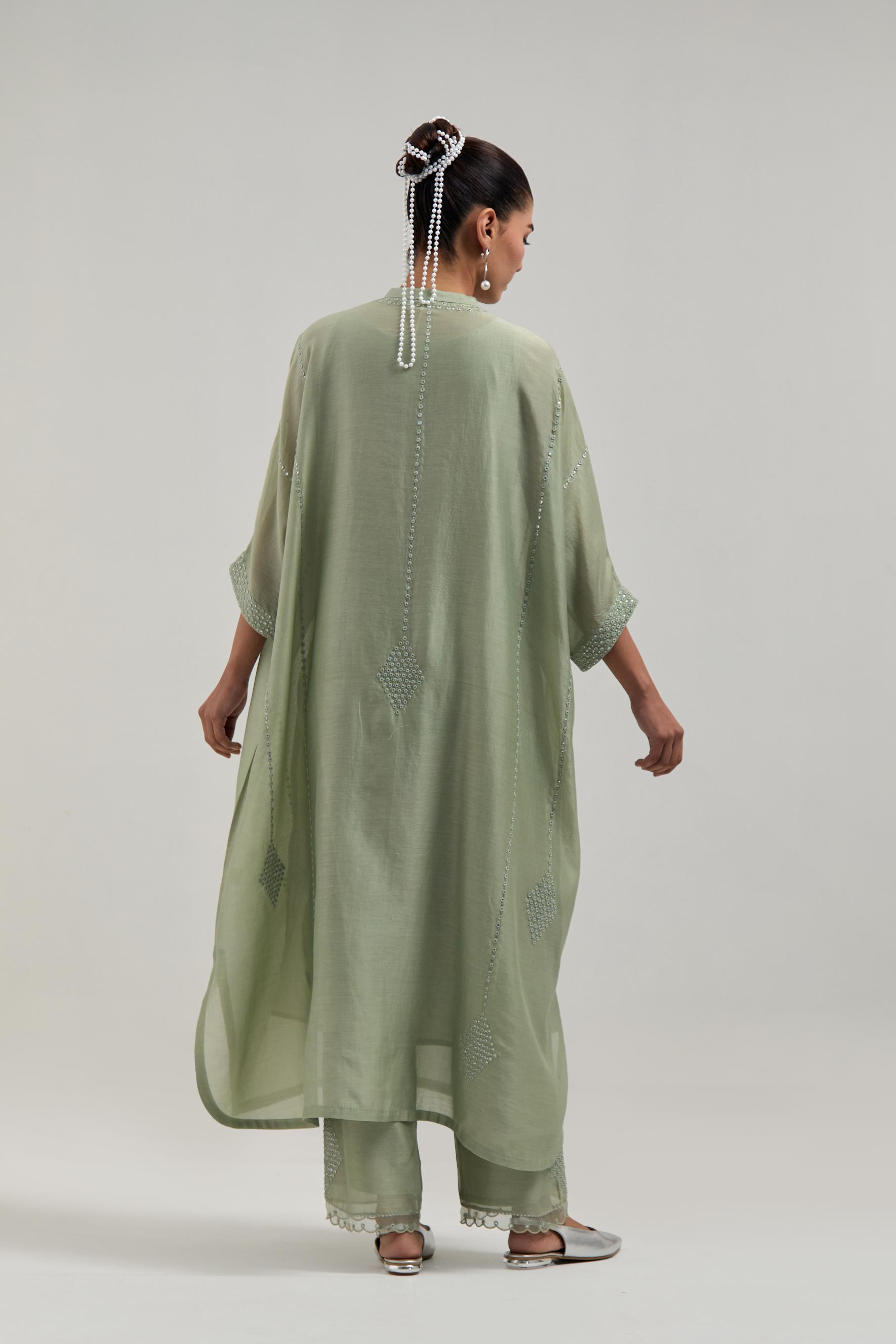 Green silk Chanderi long kaftan with hand-embroidered mirror and sequins at the neck and diamond motifs along the sides, paired with Green silk Chanderi straight pants with narrow organza scalloped hem and hand-embroidered diamond motifs with delicate.