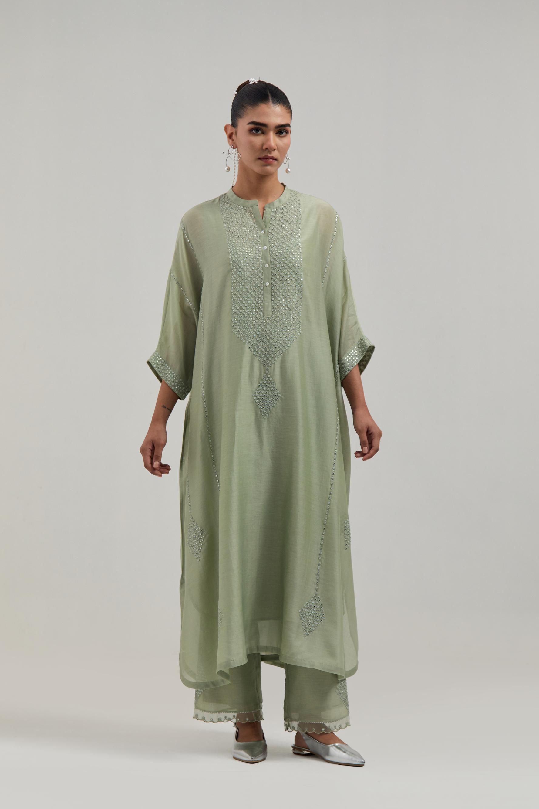Green silk Chanderi long kaftan with hand-embroidered mirror and sequins at the neck and diamond motifs along the sides, paired with Green silk Chanderi straight pants with narrow organza scalloped hem and hand-embroidered diamond motifs with delicate.